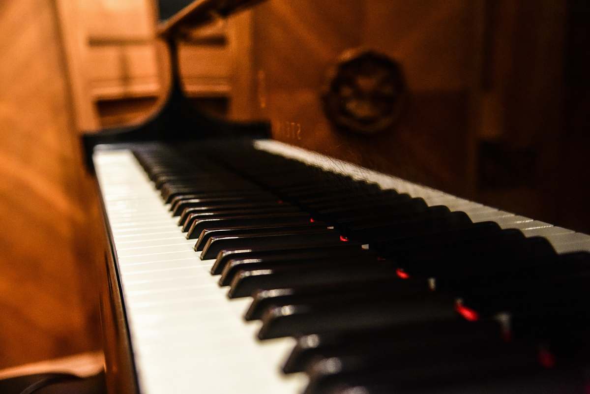 leisure activities brown upright piano grand piano